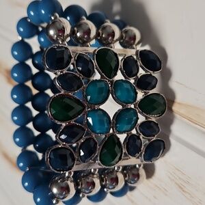 FOUR STRAND BEADED BRACLET IN TURQUISE, BLUE,NAVY AND SILVER